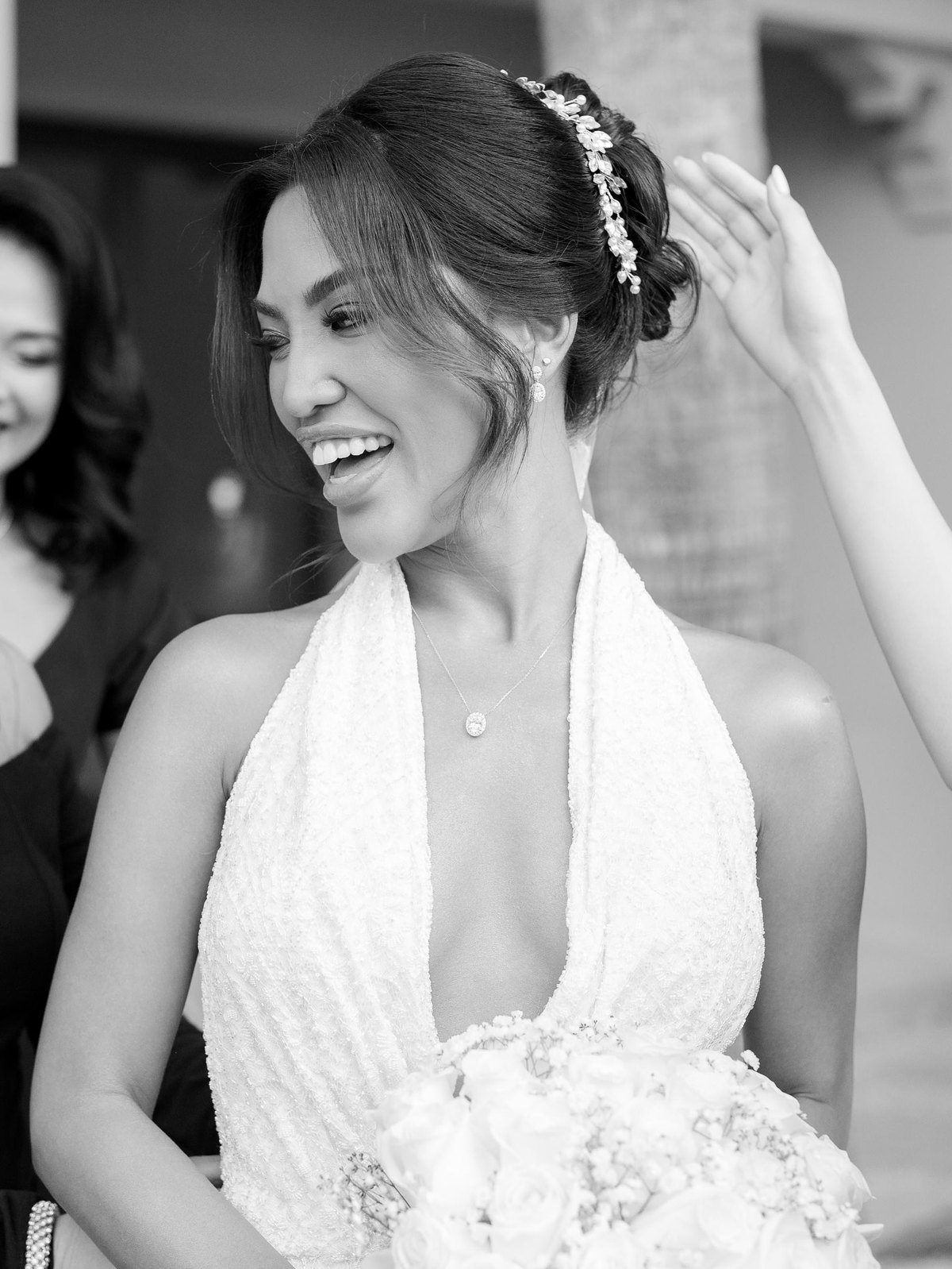 Bride in a beaded halter custom wedding dress created by Haniye, Dubai